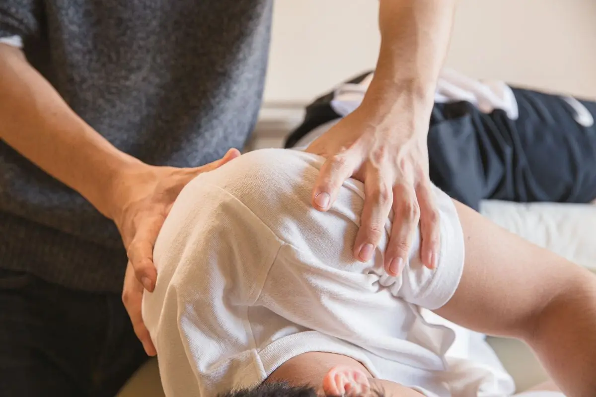 Physiotherapist providing hands-on shoulder rehabilitation